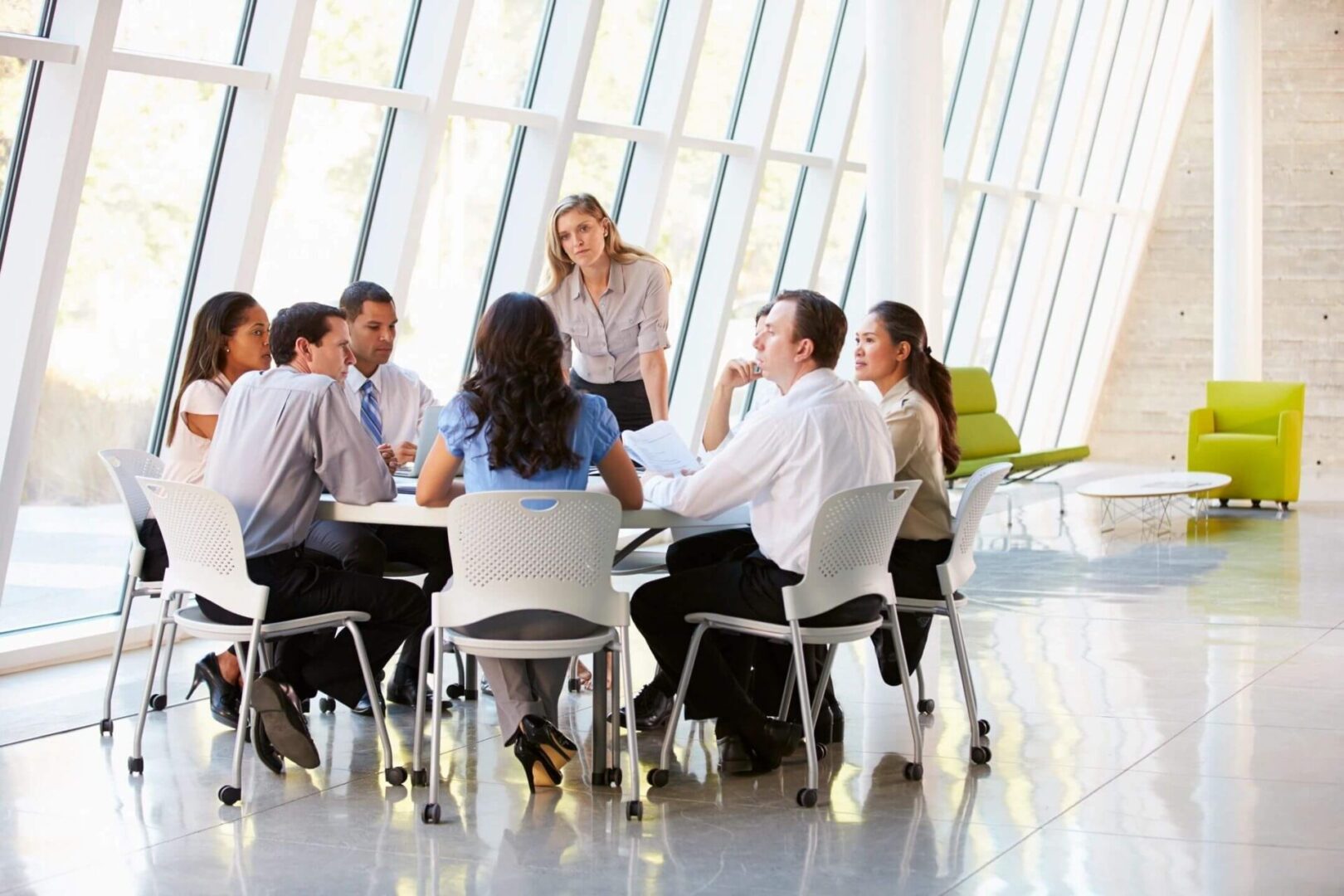 A group of people sitting around a table.